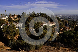 A view of downtown Los Angeles through a residential area of Ã¢â¬â¹Ã¢â¬â¹Los Feliz off the mountain at Griffith Park. photo